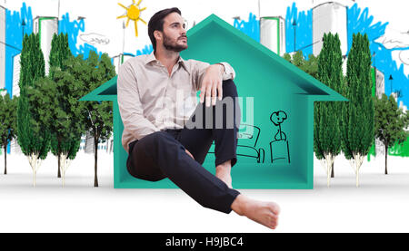 Composite image of man sitting on the floor Stock Photo