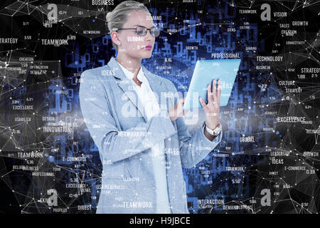 Composite image of businesswoman using digital tablet Stock Photo