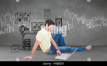 Composite image of smiling man using a laptop Stock Photo