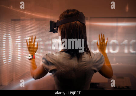 Composite image of binary code on digital screen Stock Photo