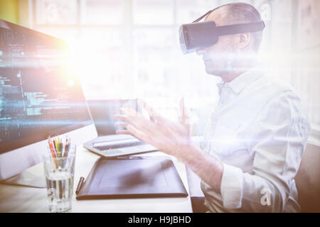 Casual businessman using virtual reality device Stock Photo