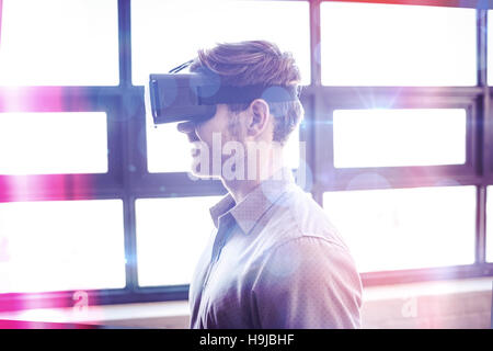 Businessman using virtual reality device Stock Photo
