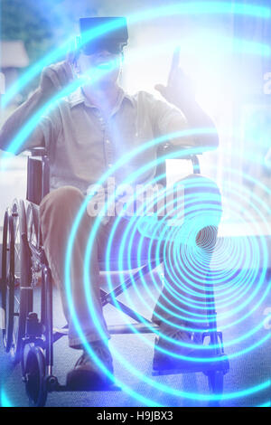 Happy senior man on wheelchair using VR headset Stock Photo