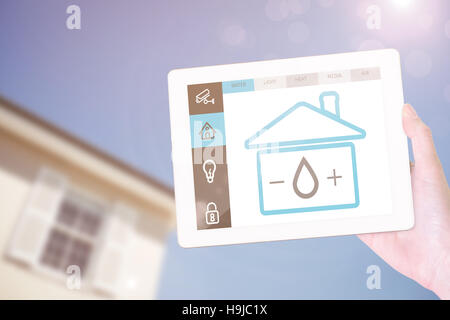 Composite image of feminine hand holding tablet Stock Photo