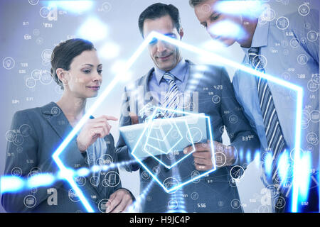Composite image of businessman showing tablet to his colleagues Stock Photo