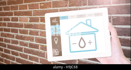 Composite image of feminine hand holding tablet Stock Photo