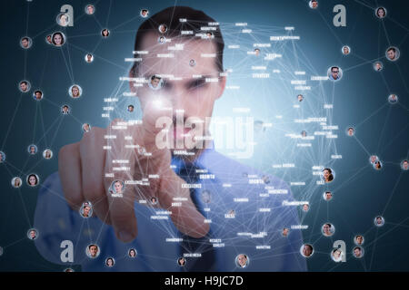 Composite image of businessman pointing his finger at camera Stock Photo