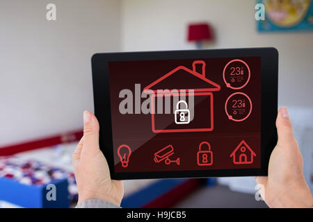 Composite image of businesswoman holding digital tablet Stock Photo