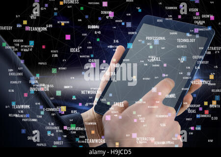 Composite image of businessman using digital tablet over white background Stock Photo