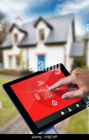 Composite image of man using tablet pc Stock Photo