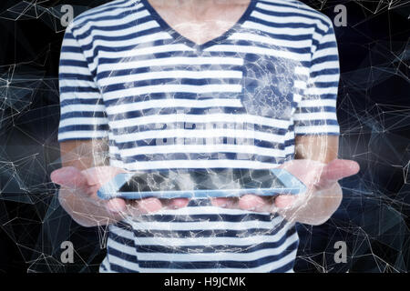 Composite image of close up of man holding tablet Stock Photo
