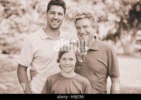 Family looking at the camera in the park Stock Photo