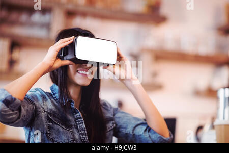 Young woman using the virtual reality headset Stock Photo