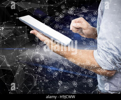 Composite image of businessman using digital tablet over white background Stock Photo