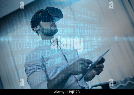 Composite image of shiny blue binary code on black background Stock Photo