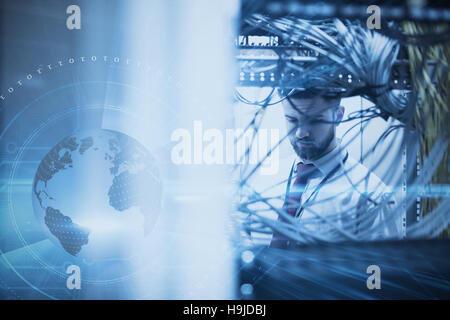 Composite image of man in a data center Stock Photo