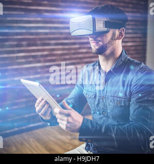 Man with virtual glass holding tablet Stock Photo