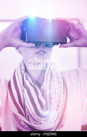 Front view of teacher using virtual reality headset Stock Photo