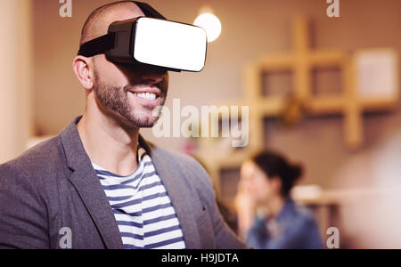 Male graphic designer wearing virtual glasses Stock Photo