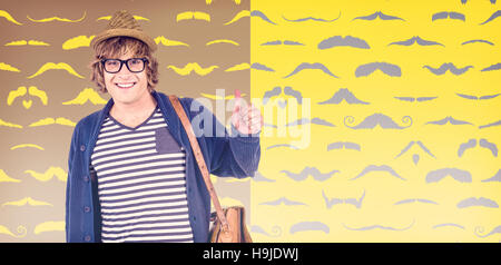 Composite image of smiling hipster making thumbs up Stock Photo