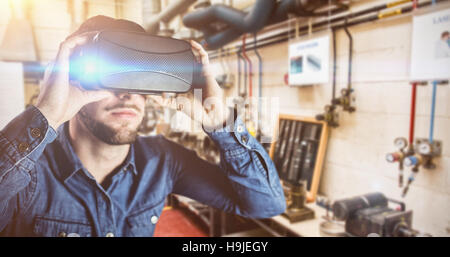 Composite image of man using an oculus Stock Photo
