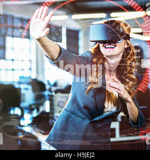 Cheerful woman using virtual reality simulator Stock Photo