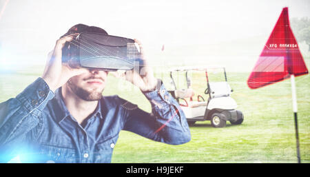 Composite image of man using an oculus Stock Photo