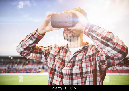 Composite image of man using an oculus Stock Photo