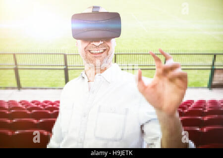 Composite image of man using an oculus Stock Photo