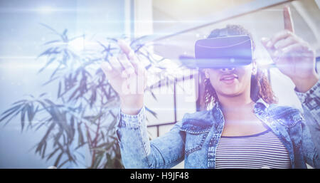 Low angle view of businesswoman enjoying augmented reality headset at office Stock Photo