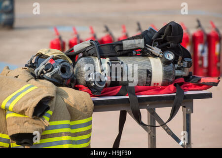 firefighter helmet and suit Stock Photo