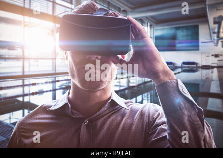 Composite image of man using an oculus Stock Photo