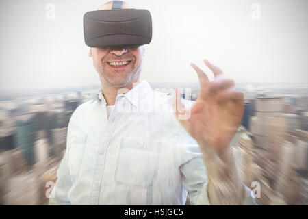 Composite image of man using an oculus Stock Photo