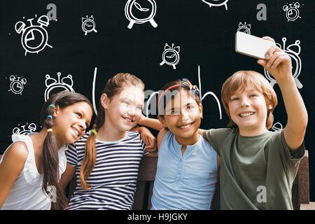 Composite image of happy children taking selfie at park Stock Photo