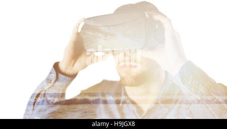 Composite image of man using an oculus Stock Photo