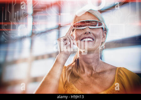 Composite image of icons on circuit board Stock Photo