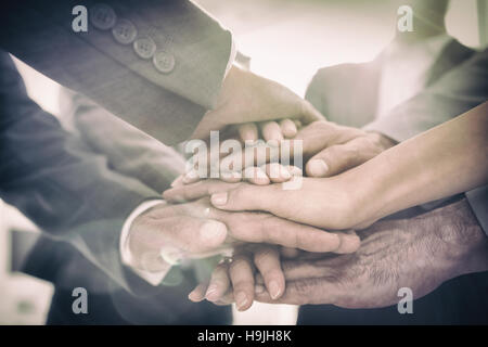 Business team standing hands together Stock Photo