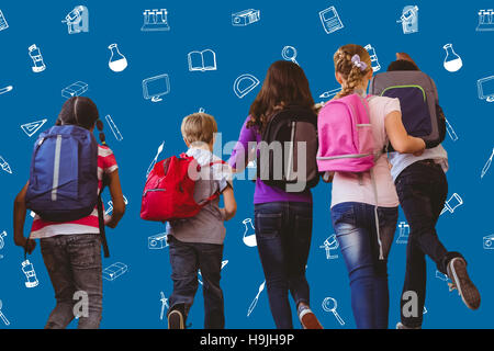 Composite image of school kids running in school corridor Stock Photo