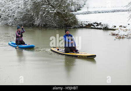 Paddle boarding on the icy Grand Union Canal at Foxton locks, Foxton, Leicestershire, England, UK Stock Photo