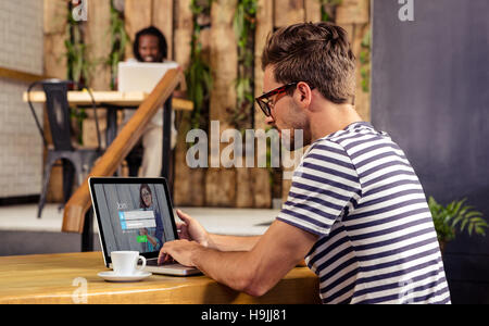 Composite image of login with smiling glasses woman and pad Stock Photo