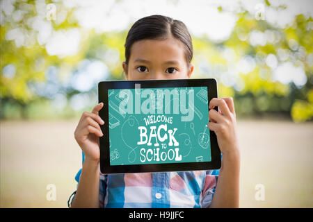 Composite image of back to school written on chalkboard Stock Photo