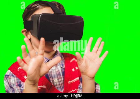 Composite image of boy wearing virtual reality headset Stock Photo