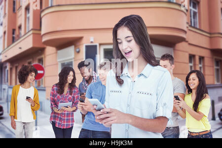 Composite image of woman using mobile phone Stock Photo