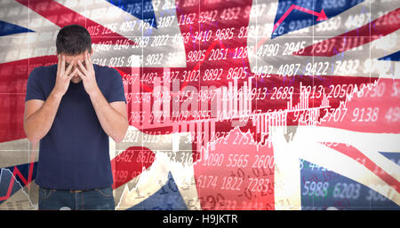 Composite image of upset man standing with his head in hands Stock Photo