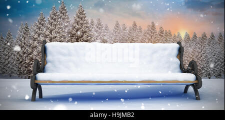 Composite image of bench covered with snow Stock Photo