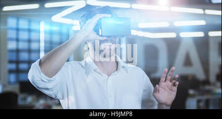 Businessman wearing virtual reality simulator Stock Photo