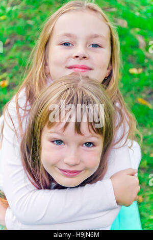 Photo of two cute girls with long hairs Stock Photo