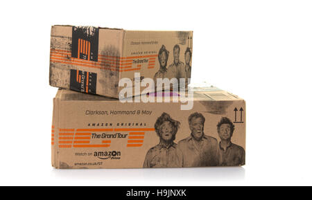Pile of Amazon boxes stacked on an white background Stock Photo