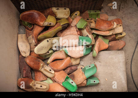 Shoe lasts in cobbler's workshop Stock Photo