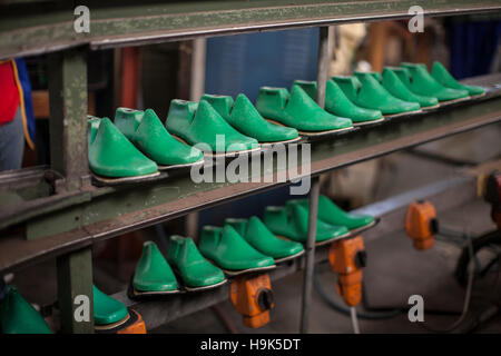 Shoe lasts on shelf in cobbler's workshop Stock Photo